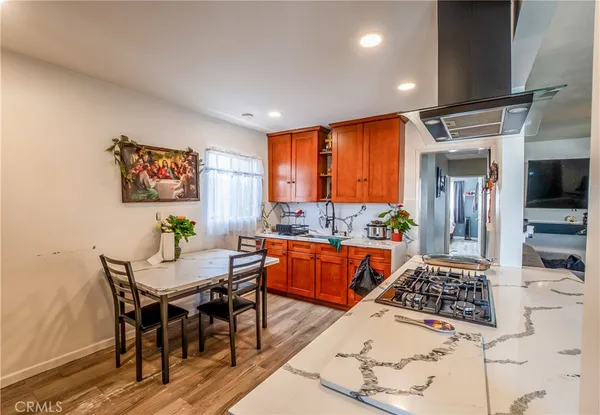 a large kitchen with a table and chairs in it