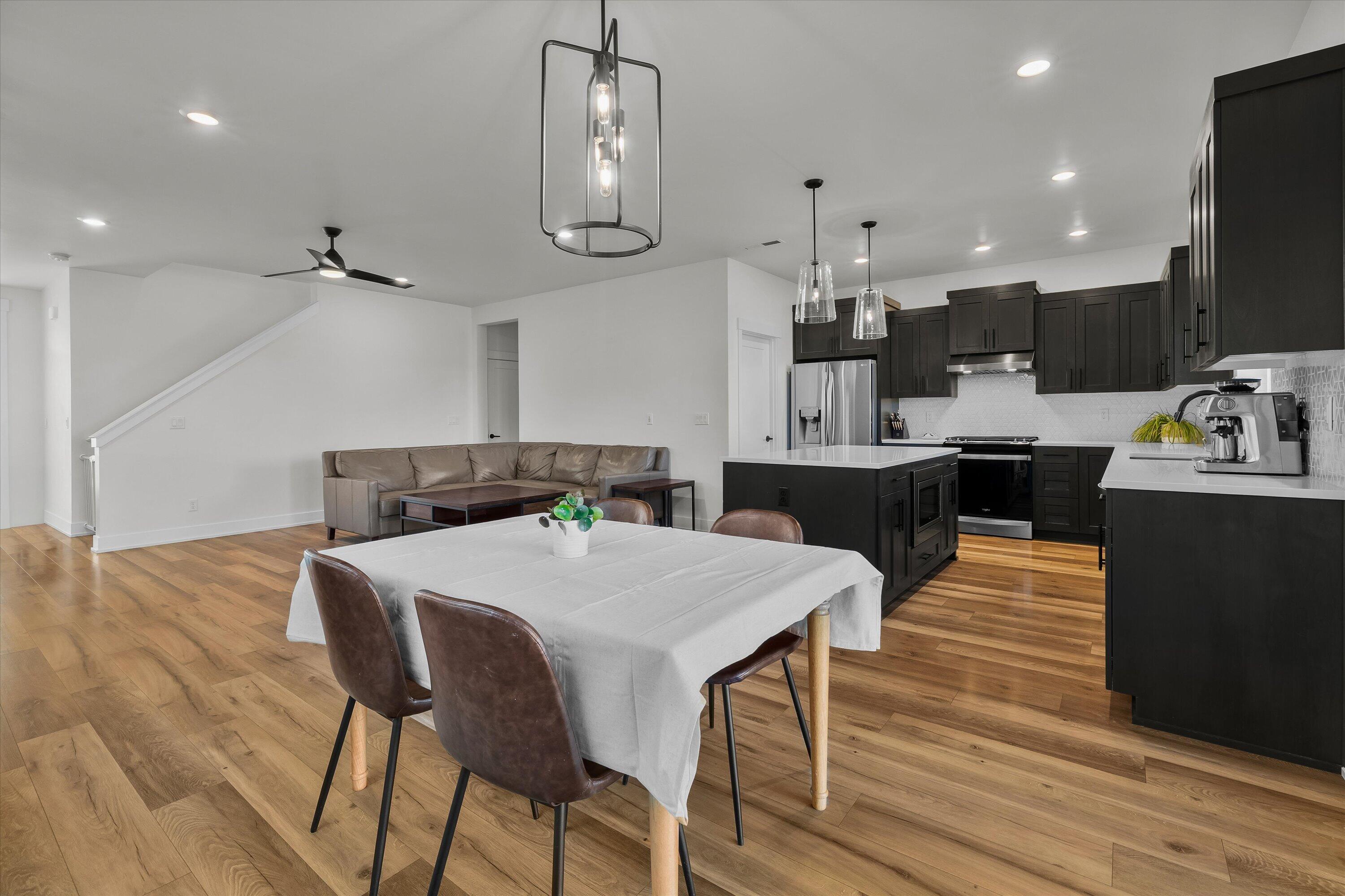 60903 Southeast Epic Place Bend, OR 97702 - Photo 16 of 48 a large kitchen with a table and chairs