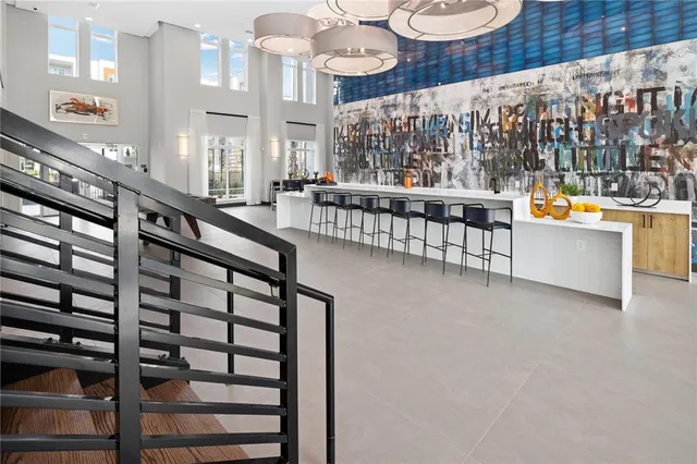 a view of a swimming pool and outdoor seating