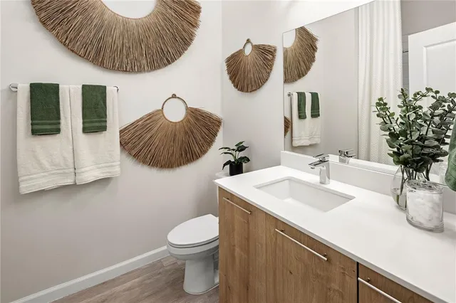 a bathroom with a sink a mirror and vanity