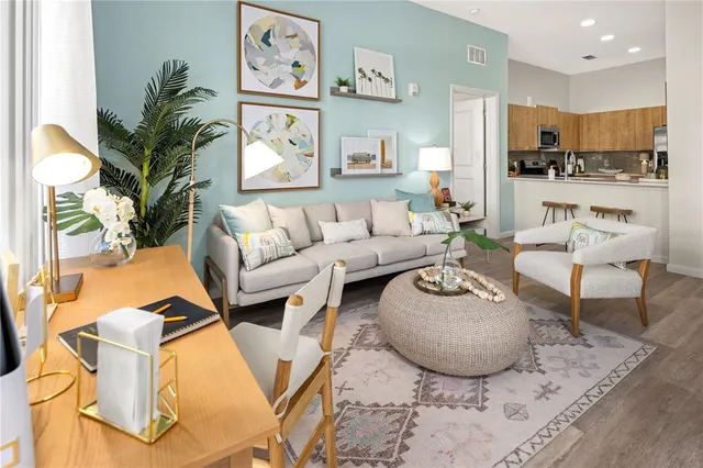 a living room with furniture and a large window