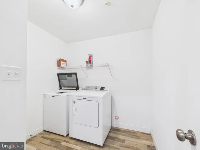 a view of storage and utility room with washer and dryer