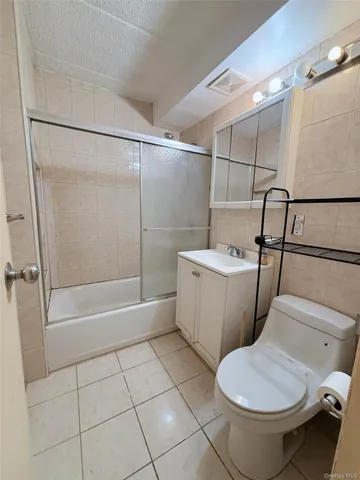 a bathroom with a toilet a sink and a shower