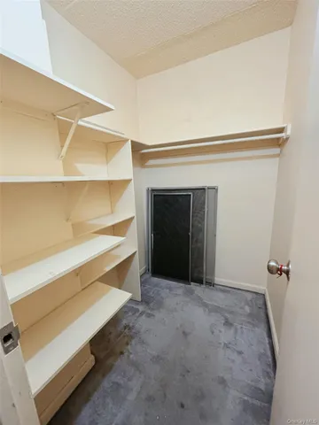 a view of an empty room with a fireplace