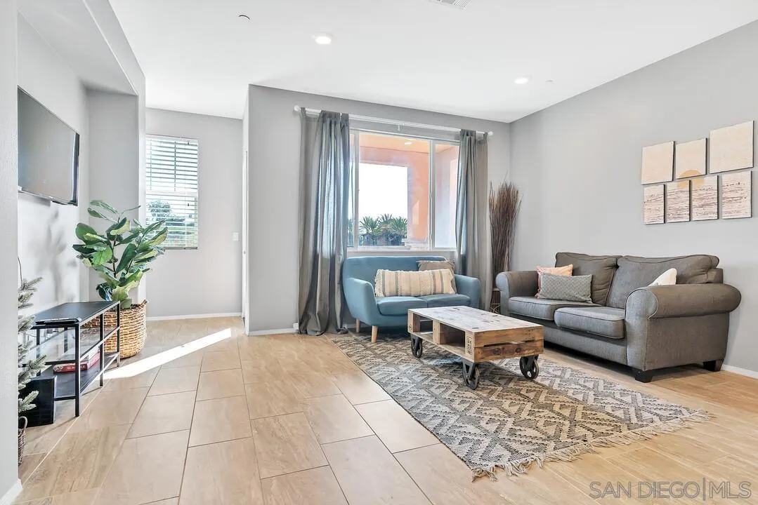 2840 Athens Road, Unit 10 Chula Vista, CA 91915 - Photo 1 of 35 a living room with furniture and a potted plant