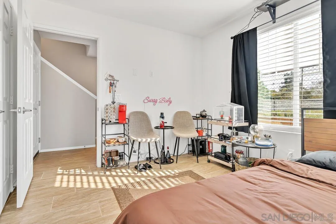 2840 Athens Road, Unit 10 Chula Vista, CA 91915 - Photo 12 of 35 a bedroom with a bed and a table