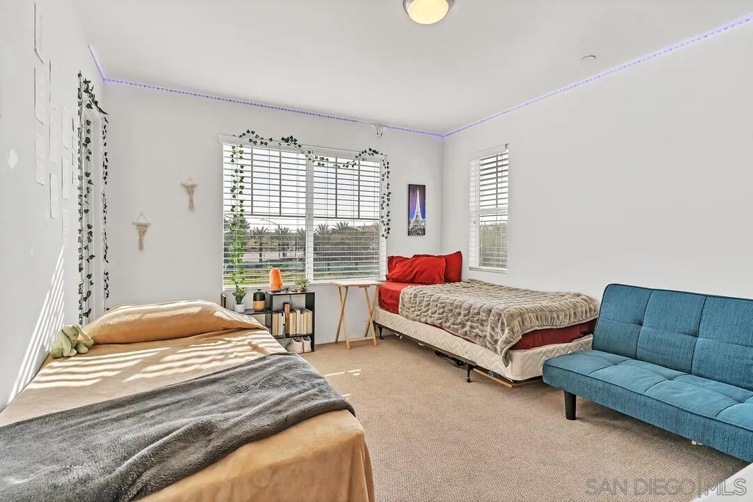 2840 Athens Road, Unit 10 Chula Vista, CA 91915 - Photo 15 of 35 a bedroom with a bed couch and window