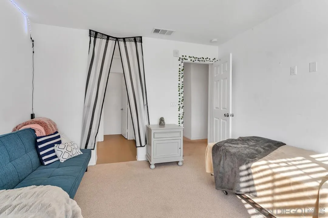 2840 Athens Road, Unit 10 Chula Vista, CA 91915 - Photo 16 of 35 a bedroom with a bed and a window