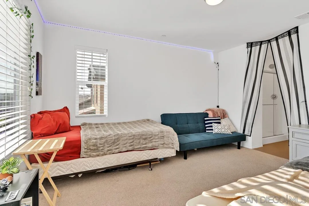 2840 Athens Road, Unit 10 Chula Vista, CA 91915 - Photo 17 of 35 a bedroom with a bed and wooden floor