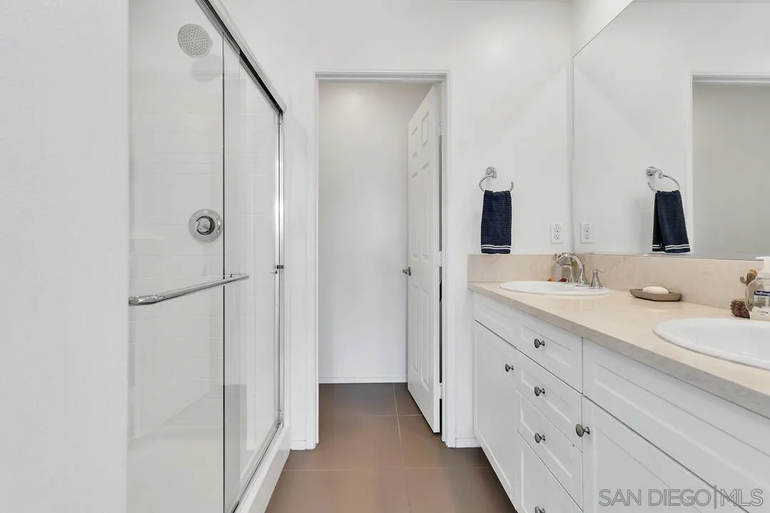 2840 Athens Road, Unit 10 Chula Vista, CA 91915 - Photo 18 of 35 a bathroom with a double vanity sink and mirror
