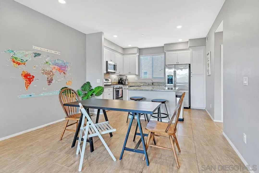 2840 Athens Road, Unit 10 Chula Vista, CA 91915 - Photo 2 of 35 a dining room with furniture and wooden floor