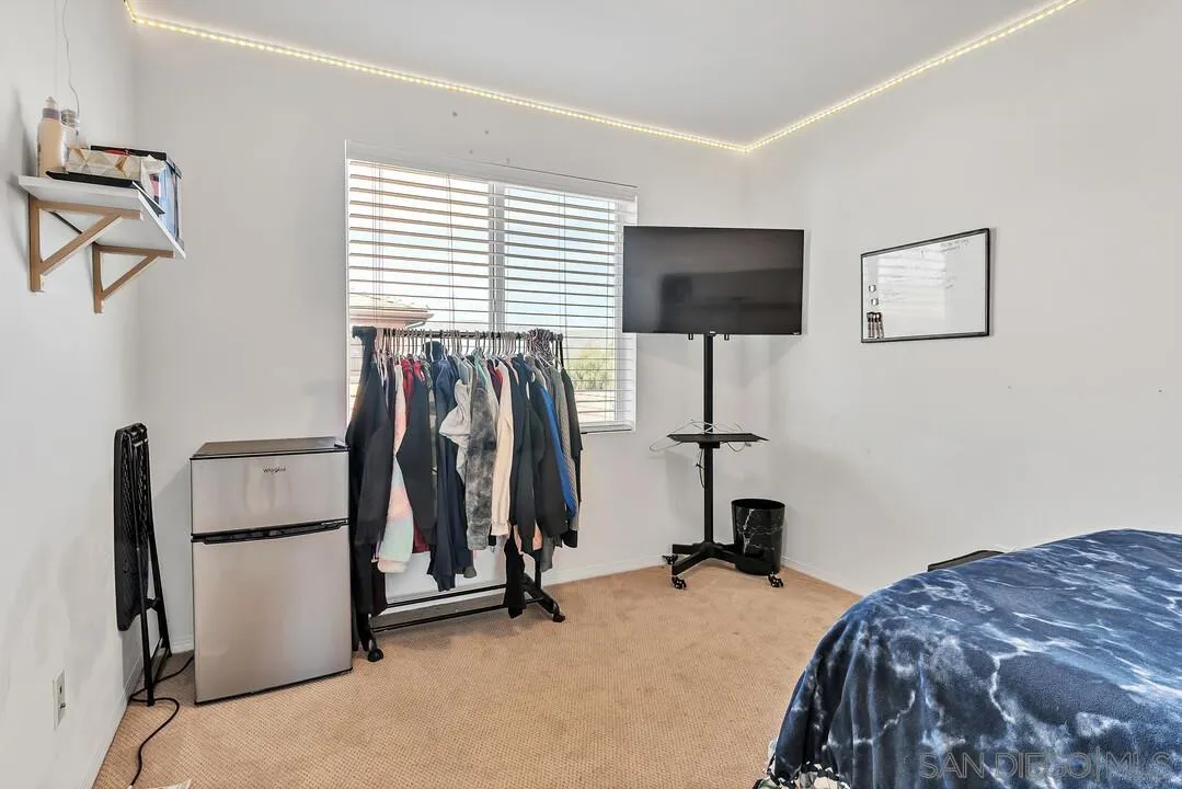 2840 Athens Road, Unit 10 Chula Vista, CA 91915 - Photo 21 of 35 a bedroom with a bed and a flat tv screen