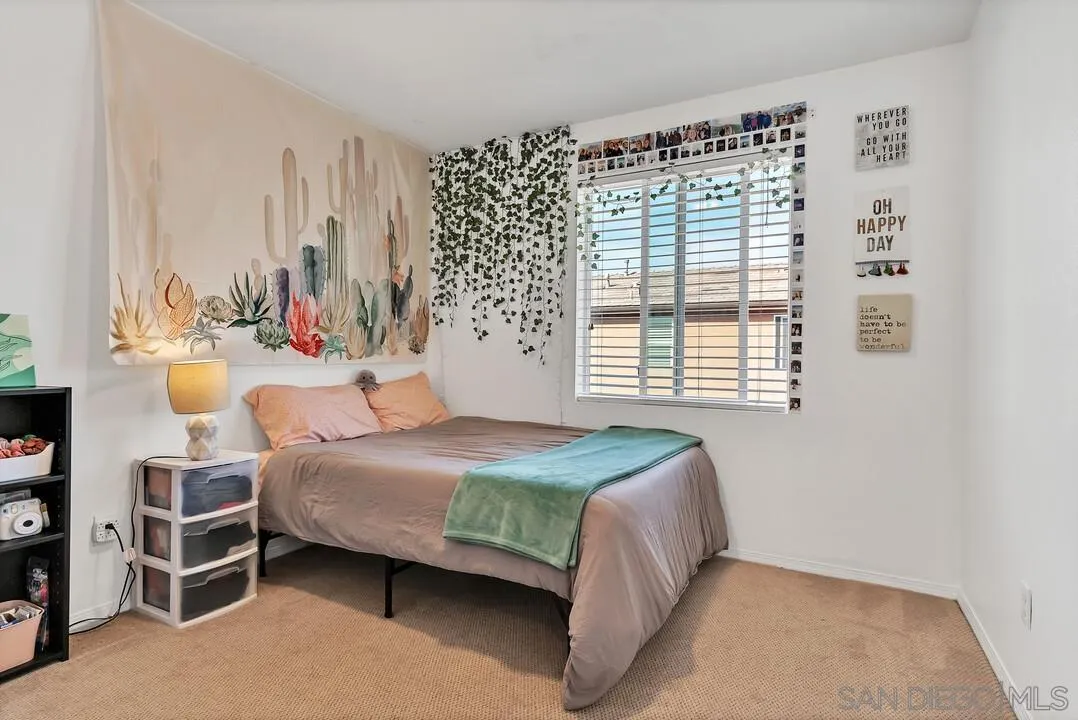 2840 Athens Road, Unit 10 Chula Vista, CA 91915 - Photo 22 of 35 a bedroom with a bed and a window