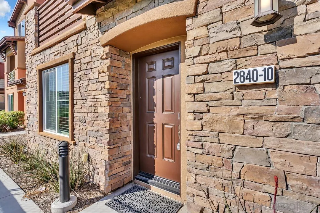 2840 Athens Road, Unit 10 Chula Vista, CA 91915 - Photo 26 of 35 a brick building with a street sign on the wall