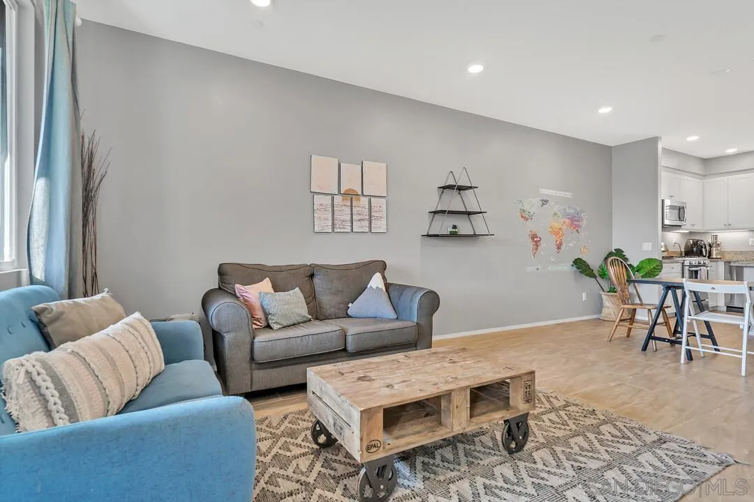 2840 Athens Road, Unit 10 Chula Vista, CA 91915 - Photo 10 of 35 a living room with furniture and a rug
