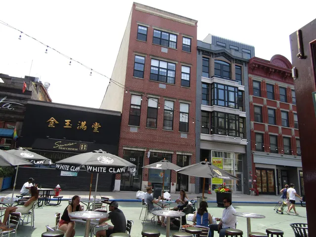 a front view of a building with parking space