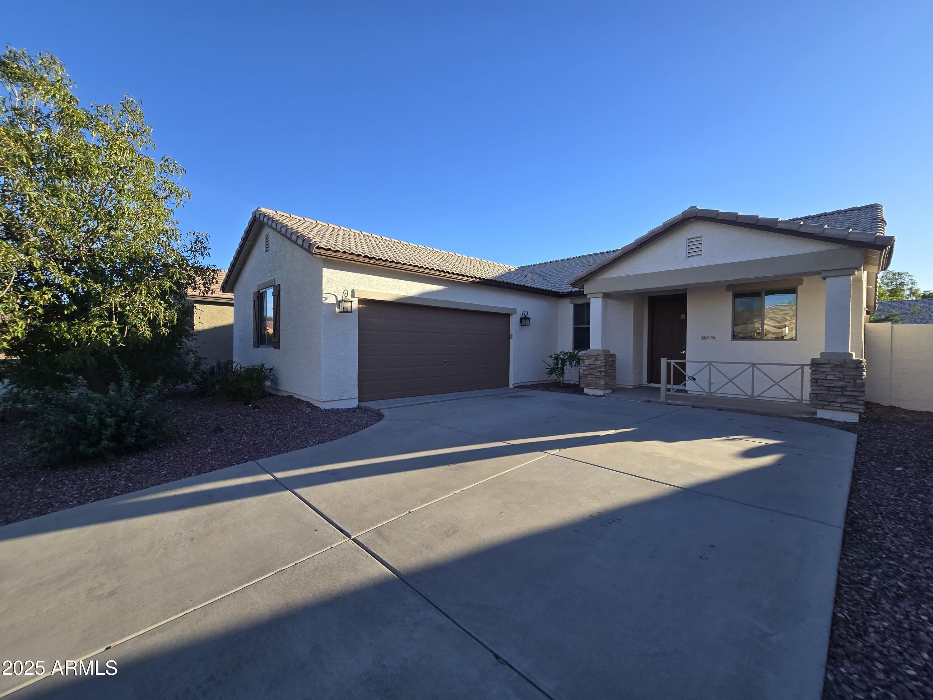 a front view of a house with yard