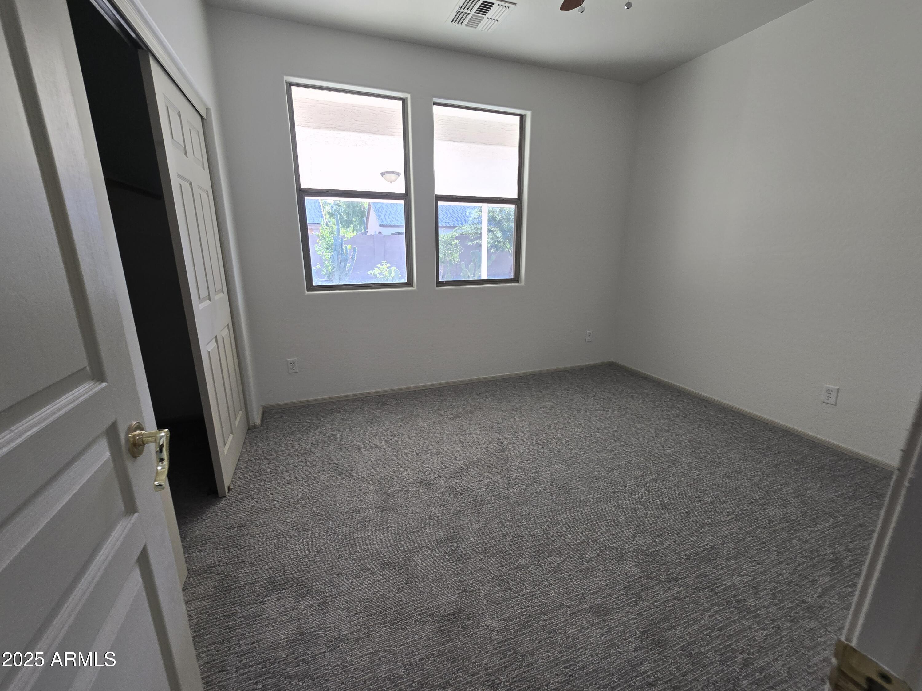 18196 Calacera Street Maricopa, AZ 85138 - Photo 11 of 21 an empty room with windows