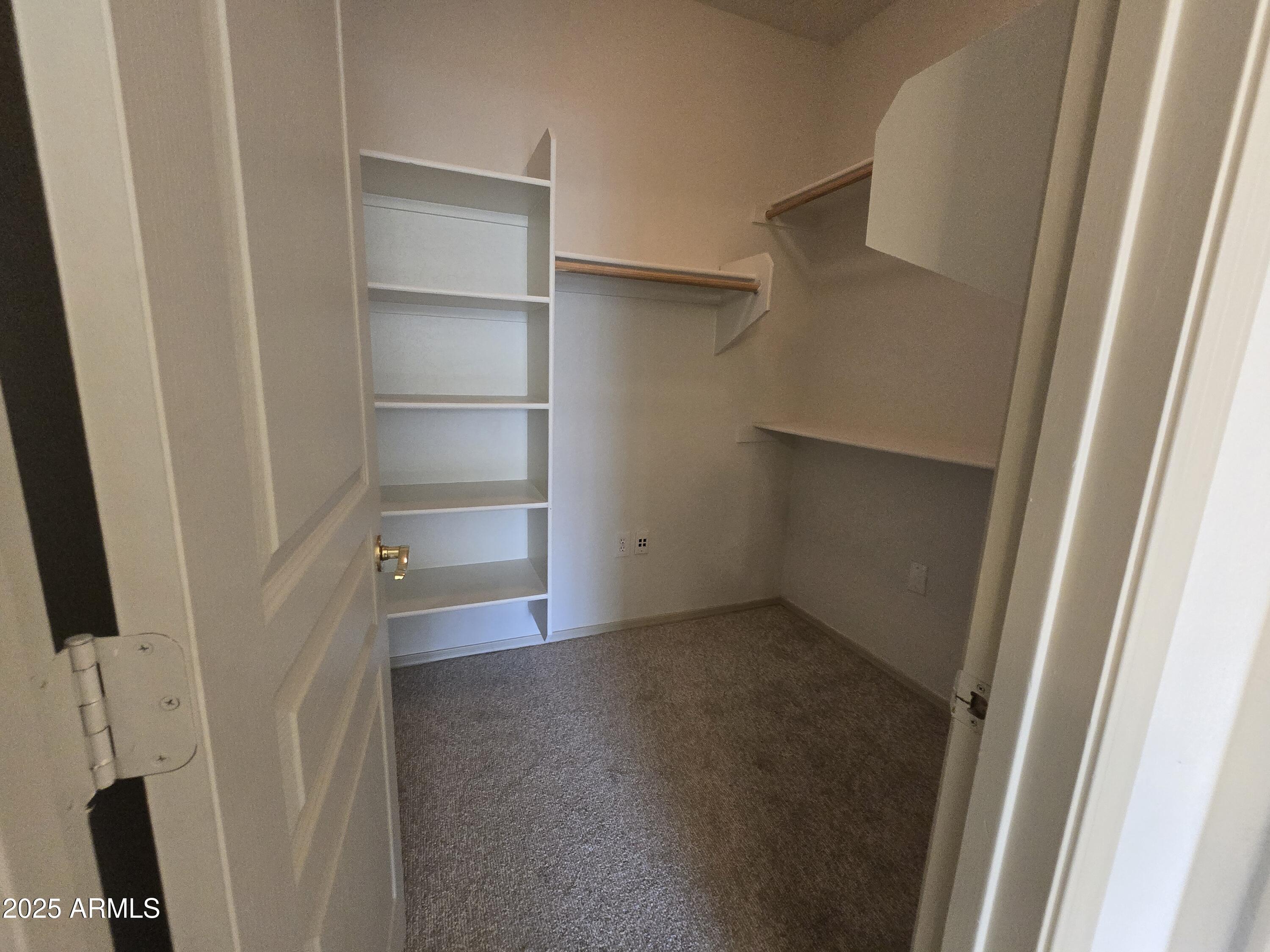 18196 Calacera Street Maricopa, AZ 85138 - Photo 17 of 21 a view of an empty walk in closet