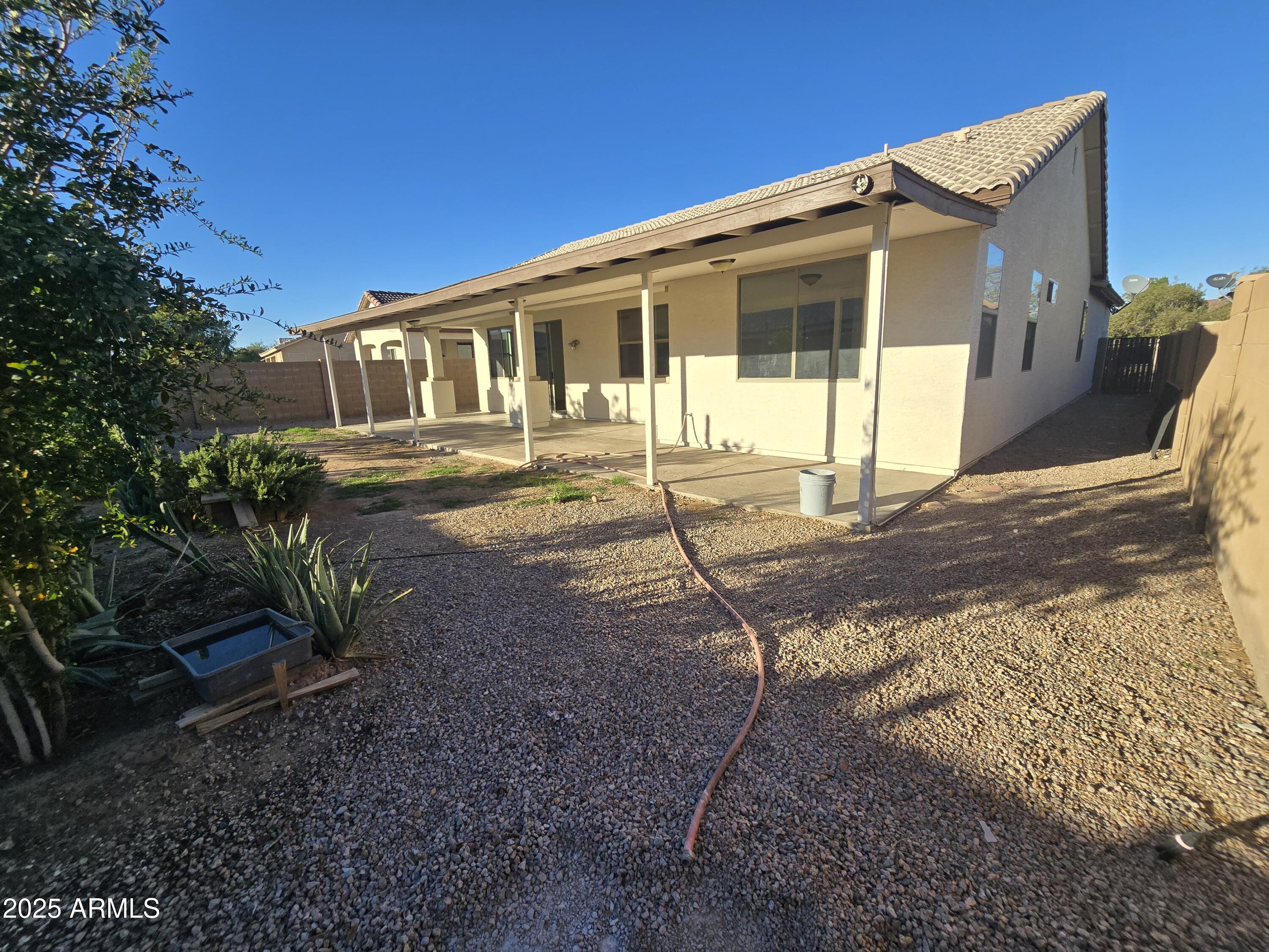 18196 Calacera Street Maricopa, AZ 85138 - Photo 20 of 21 a front view of a house with garden
