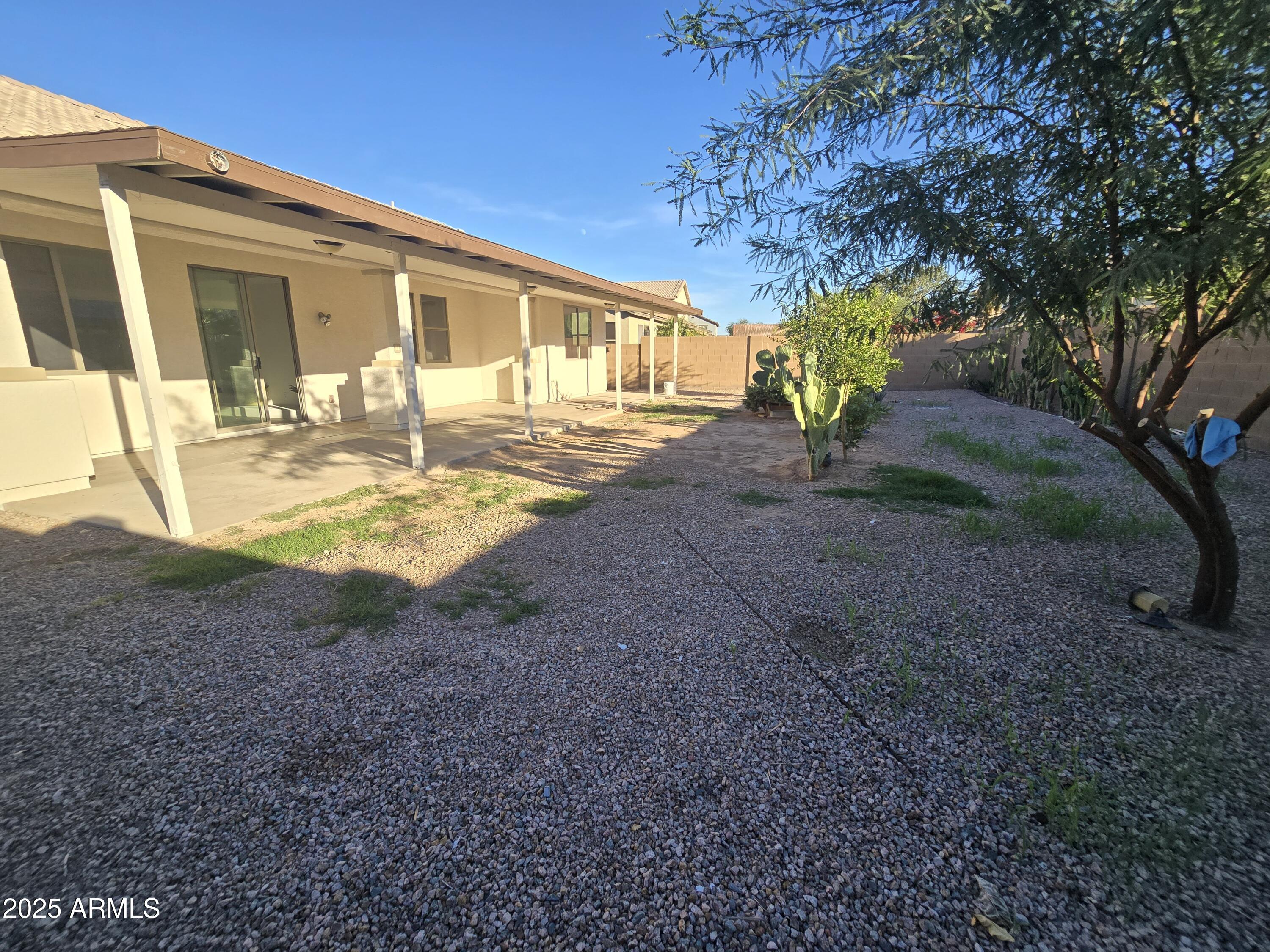 18196 Calacera Street Maricopa, AZ 85138 - Photo 21 of 21 a front view of a house with garden