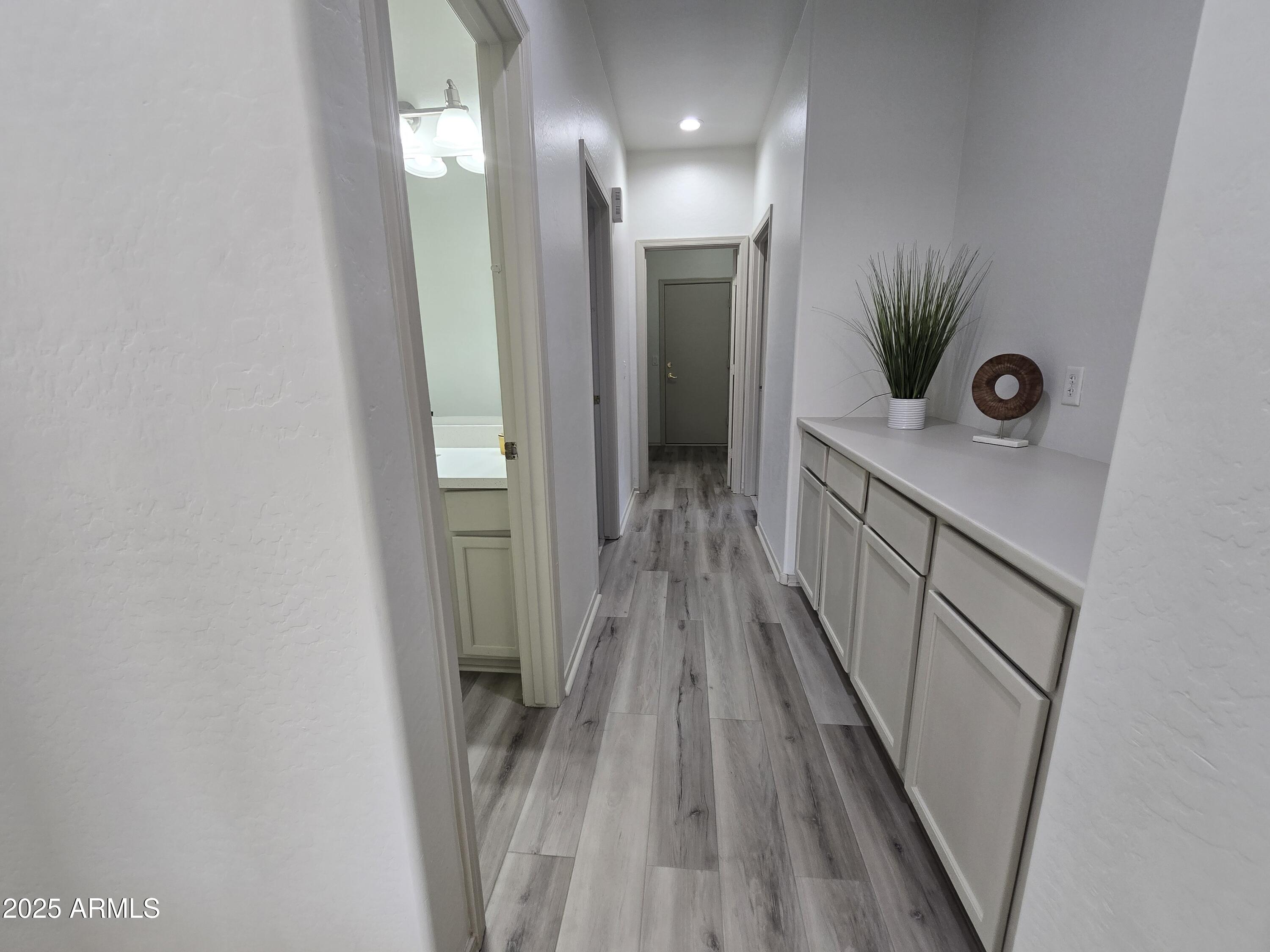 18196 Calacera Street Maricopa, AZ 85138 - Photo 10 of 21 a view of a hallway and wooden floor