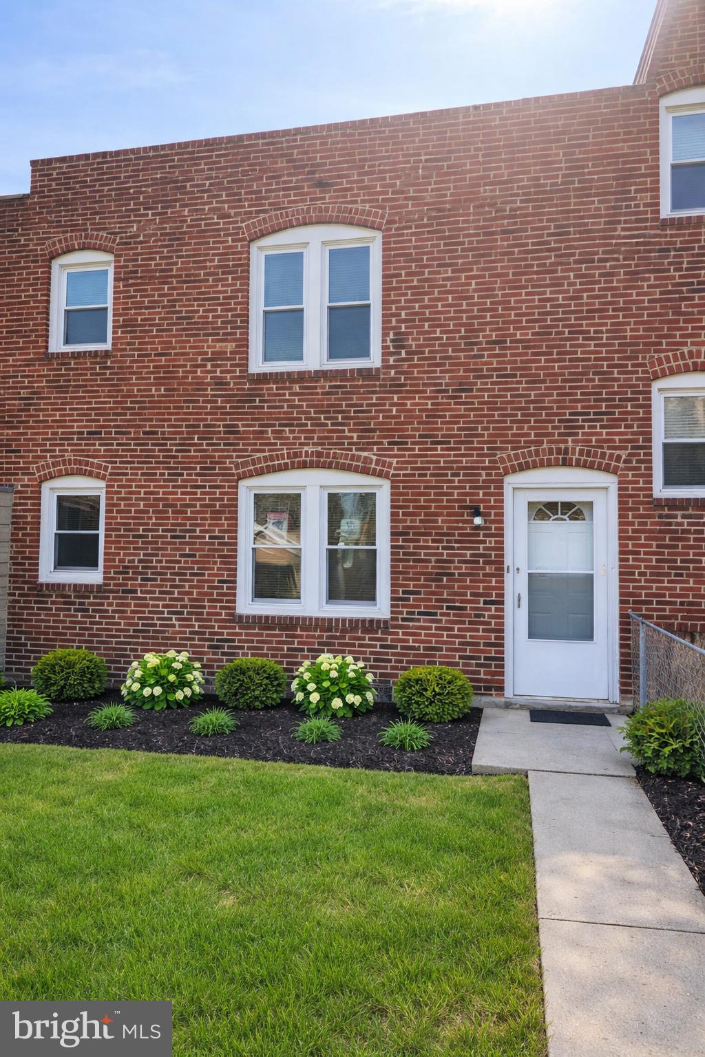1509 Filbert Street Curtis Bay, MD 21226 - Photo 1 of 30 a front view of a house with a garden