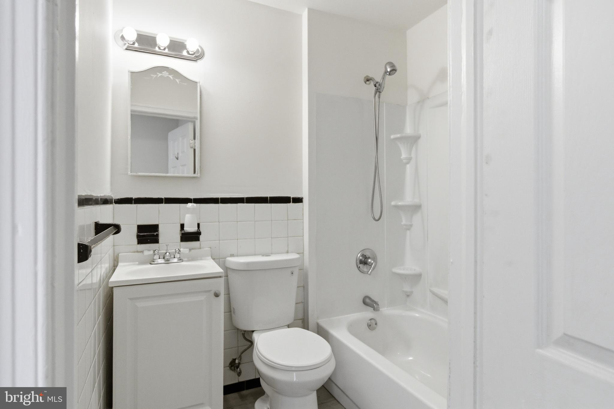 1509 Filbert Street Curtis Bay, MD 21226 - Photo 13 of 30 a bathroom with a sink toilet vanity and bathtub