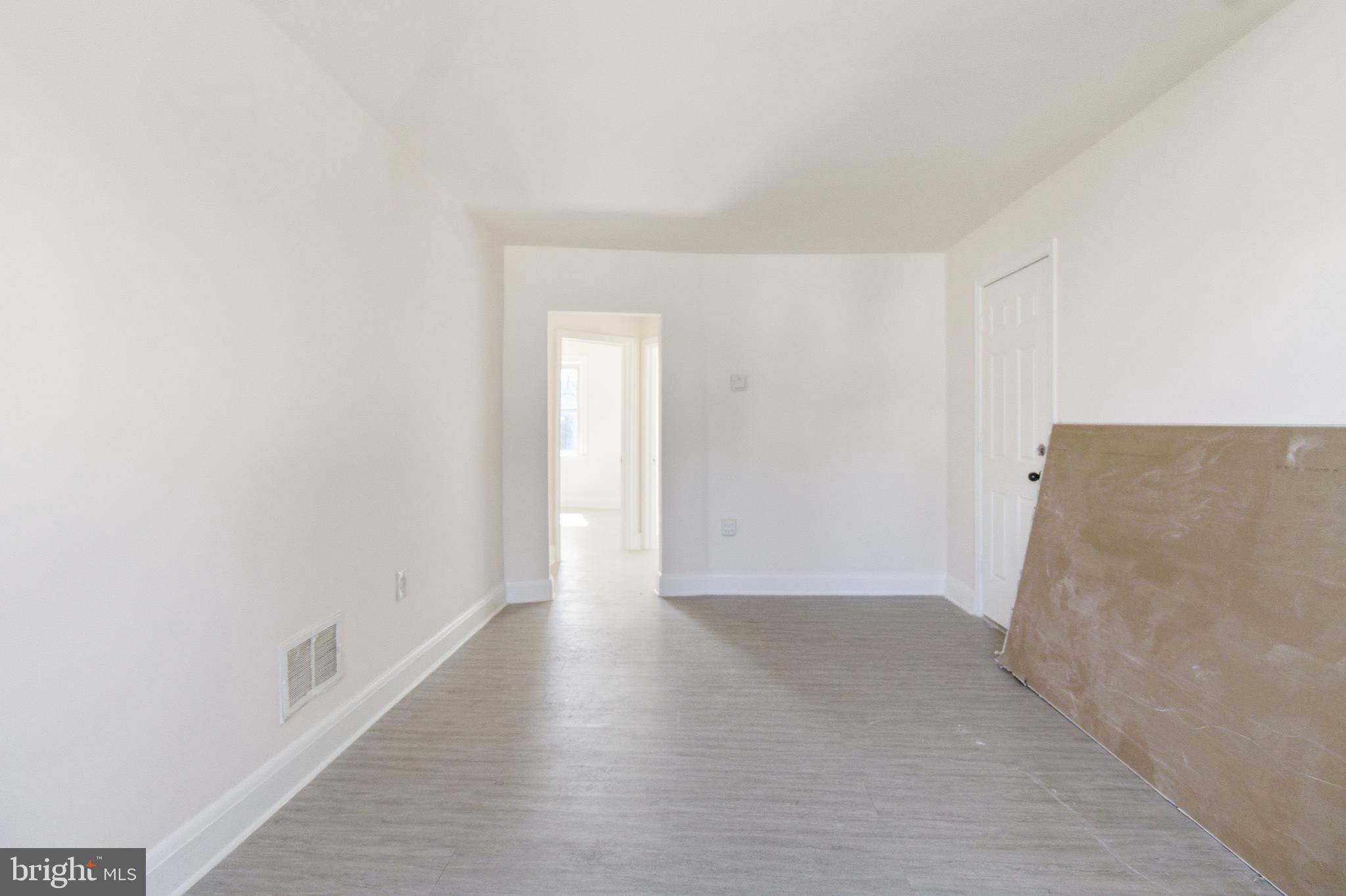 1509 Filbert Street Curtis Bay, MD 21226 - Photo 16 of 30 a view of an empty room with wooden floor