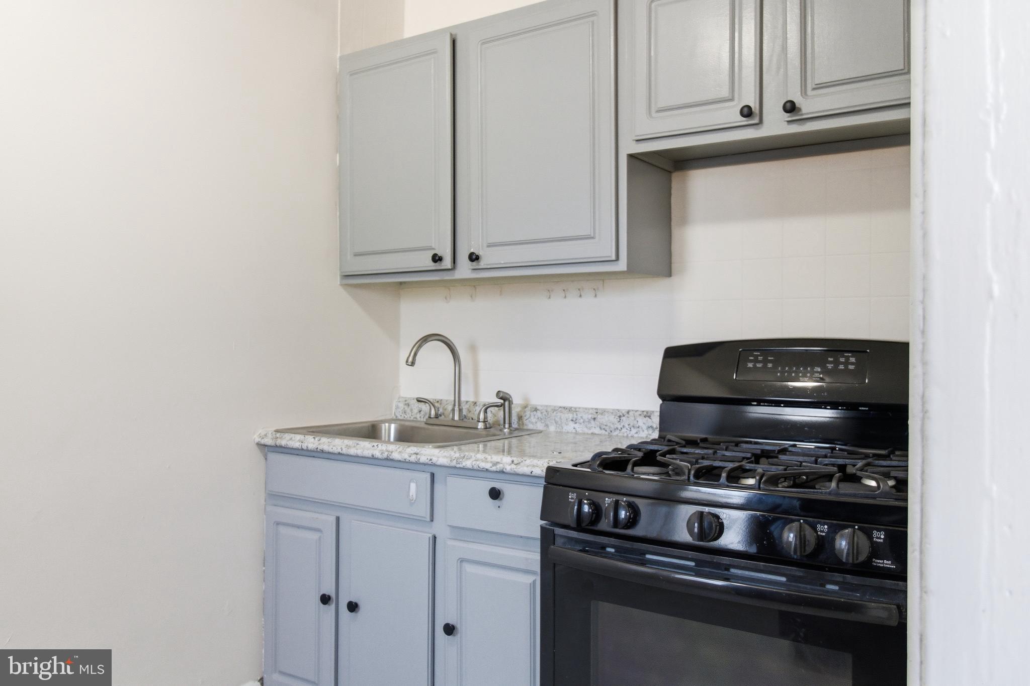 1509 Filbert Street Curtis Bay, MD 21226 - Photo 10 of 30 a stove top oven sitting inside of a kitchen