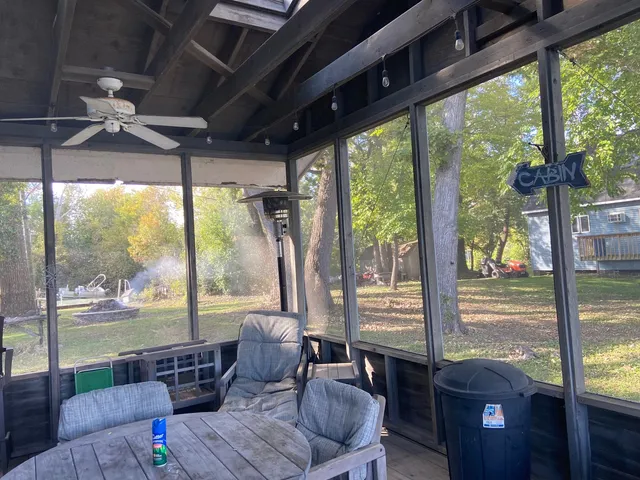 a living room with large windows