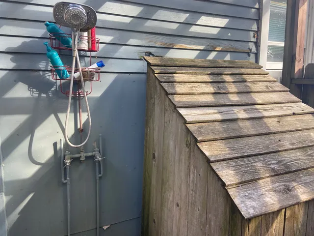 a view of outdoor space with wooden floor