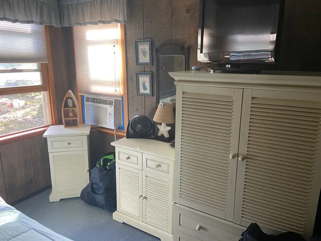 a kitchen with a refrigerator and a stove