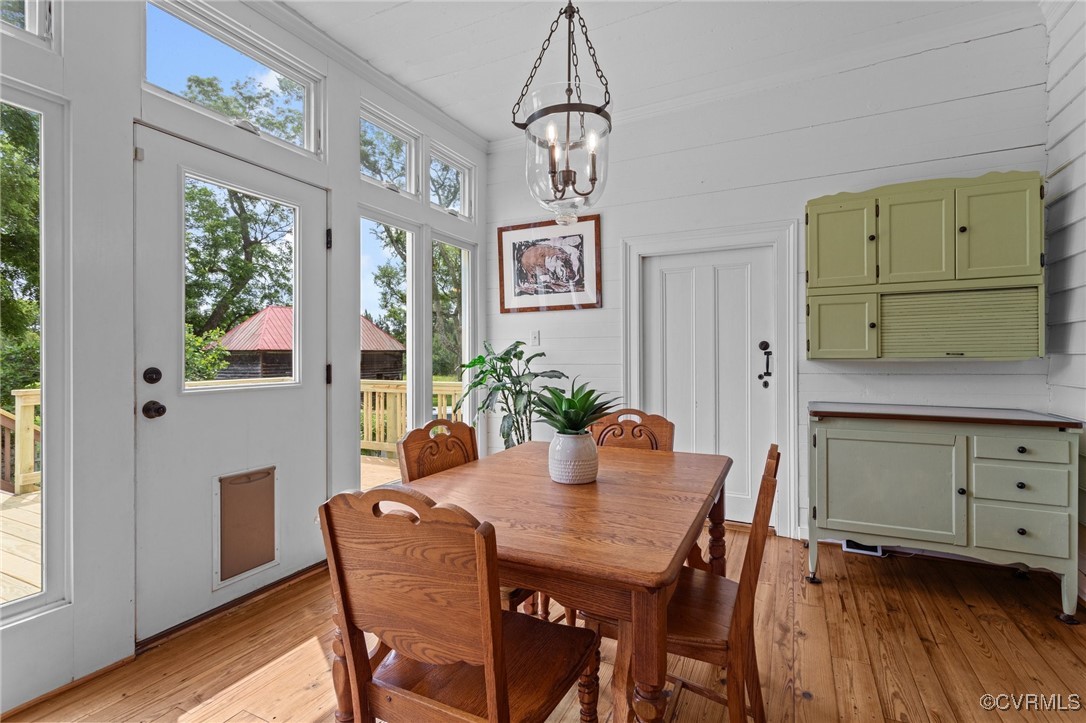 9341 Varina Road Henrico, VA 23231 - Photo 15 of 48 a view of a dining room with furniture window and wooden floor