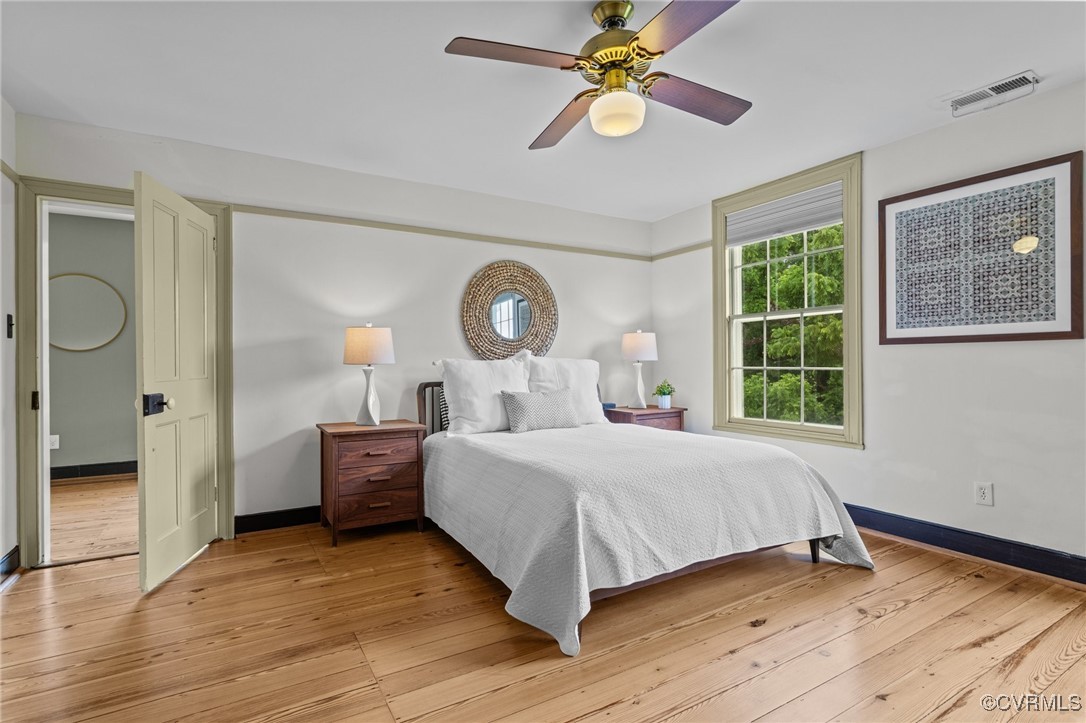 9341 Varina Road Henrico, VA 23231 - Photo 23 of 48 a bedroom with a bed chandelier and a window