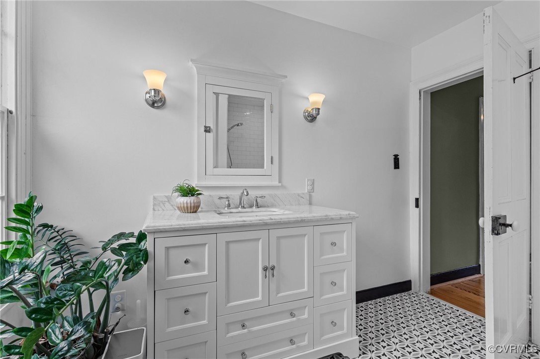 9341 Varina Road Henrico, VA 23231 - Photo 26 of 48 a bathroom with a sink a vanity and a mirror
