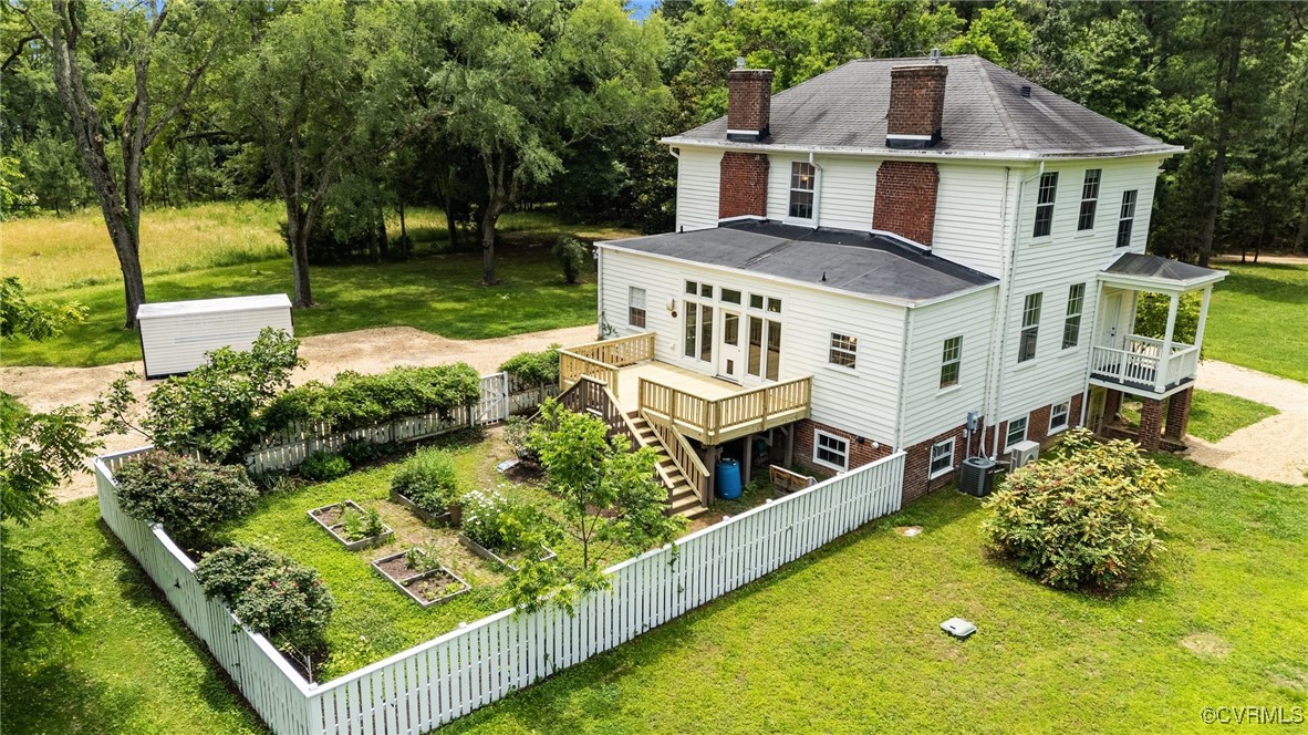 9341 Varina Road Henrico, VA 23231 - Photo 3 of 48 a aerial view of a house with swimming pool lawn chairs and a yard