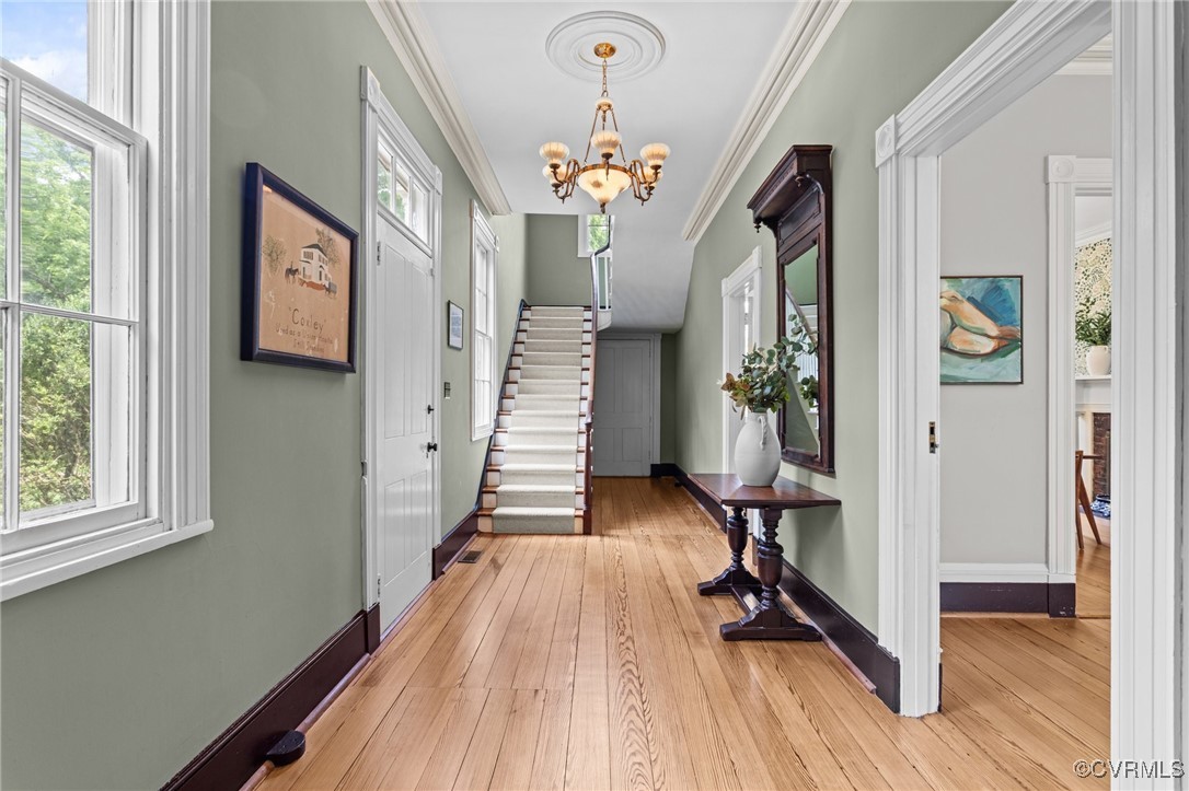 9341 Varina Road Henrico, VA 23231 - Photo 6 of 48 a view of a hallway with furniture and wooden floor