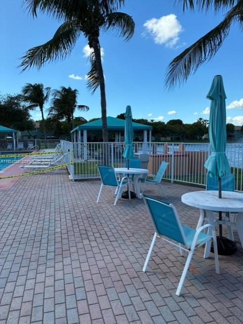 1692 Southeast 29th Court, Unit 206 Homestead, FL 33035 - Photo 13 of 15 a garden view with a seating space