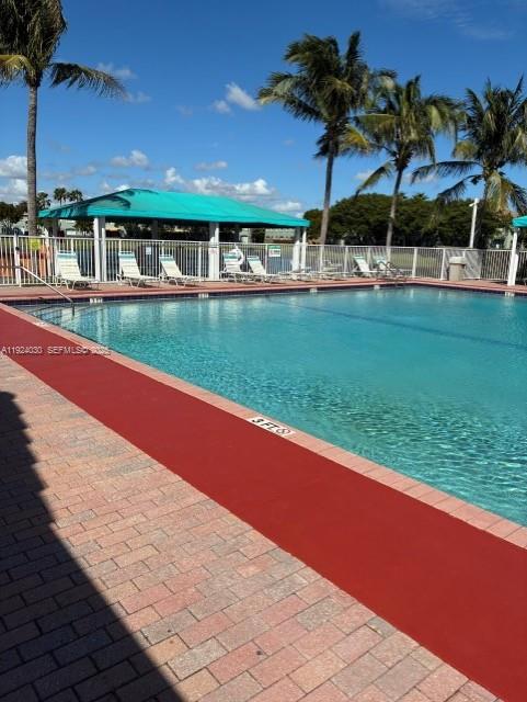 1692 Southeast 29th Court, Unit 206 Homestead, FL 33035 - Photo 14 of 15 a view of swimming pool is middle in the garden
