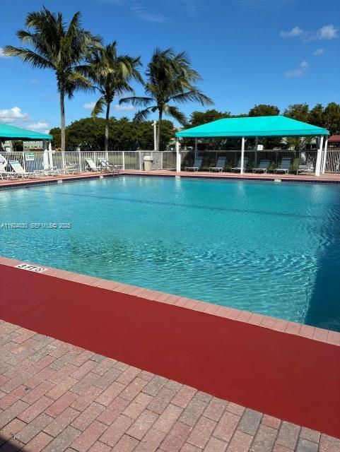 1692 Southeast 29th Court, Unit 206 Homestead, FL 33035 - Photo 15 of 15 a view of a house with a yard and sitting area