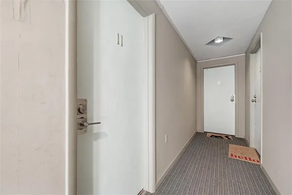 a view of a hallway with a wooden floor