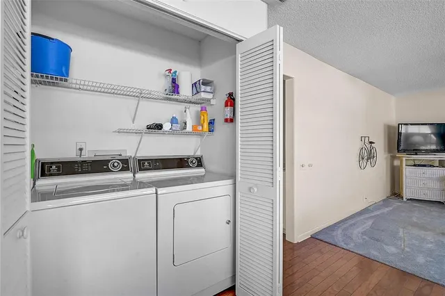 a view of storage and utility room with washer and dryer