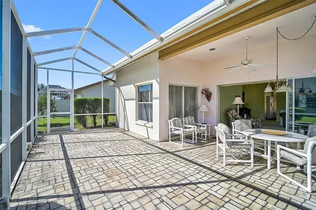 a view of a patio with a table and chairs