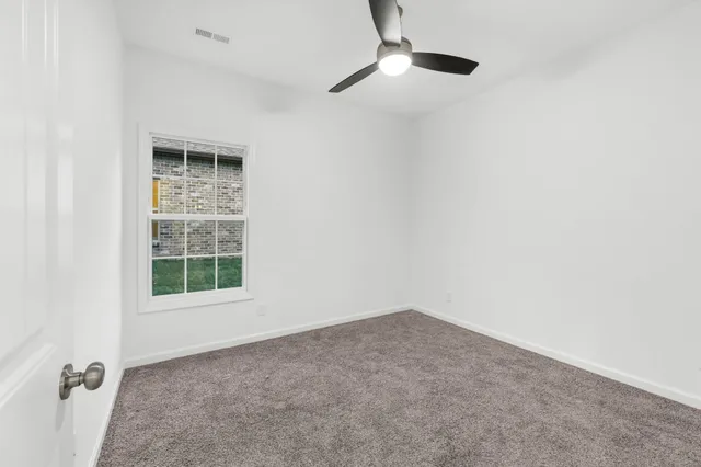 an empty room with a empty space and a window