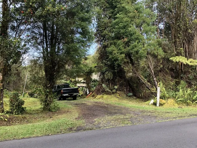 a car parked in front of a road