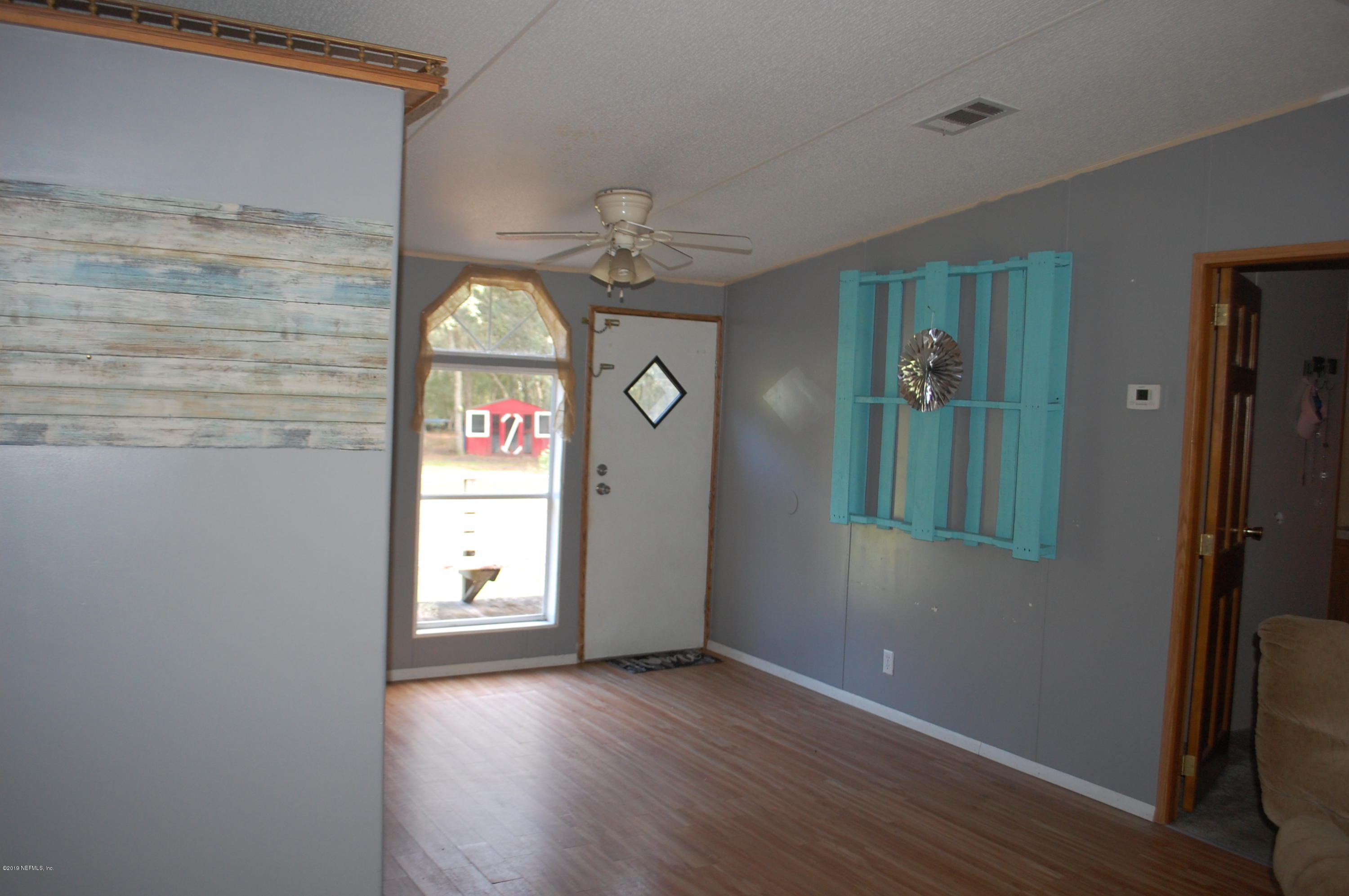 622 Lake Susan Road Hawthorne, FL 32640 - Photo 11 of 50 a view of an entryway with wooden floor