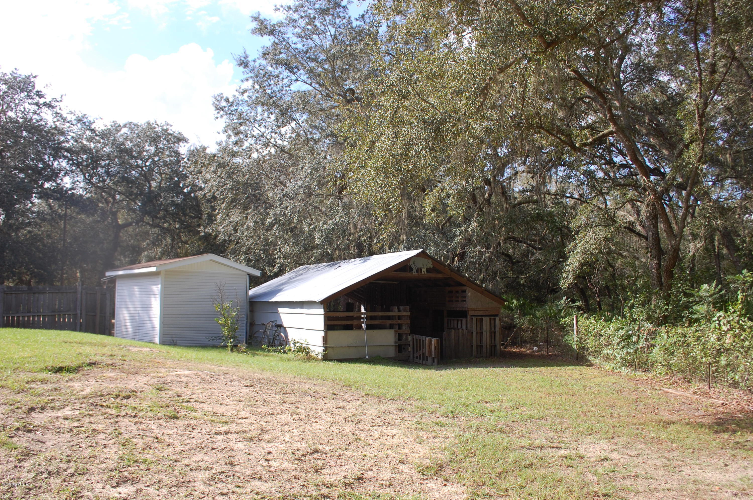 622 Lake Susan Road Hawthorne, FL 32640 - Photo 32 of 50 a front view of a house with a yard