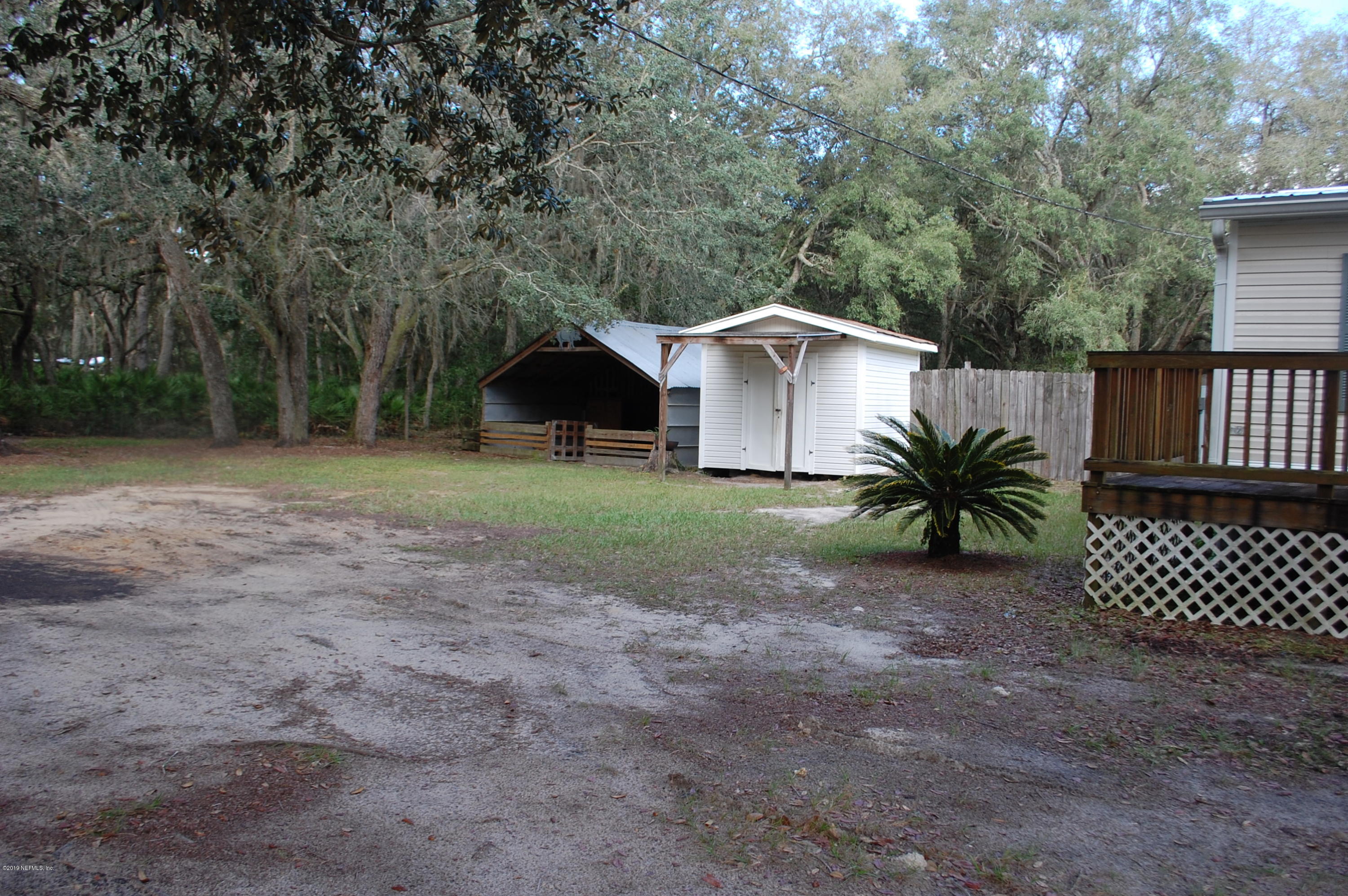 622 Lake Susan Road Hawthorne, FL 32640 - Photo 42 of 50 a front view of a house with garden