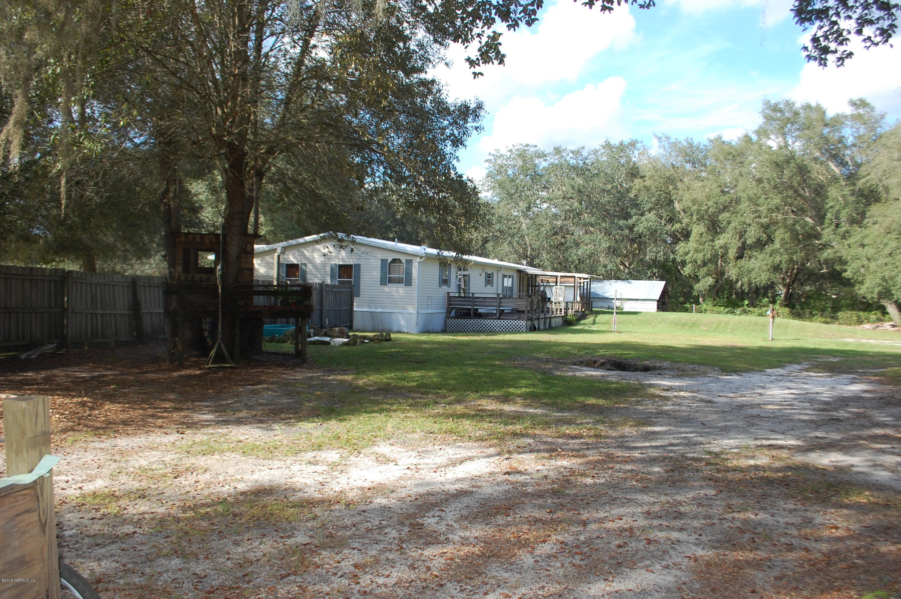 622 Lake Susan Road Hawthorne, FL 32640 - Photo 43 of 50 a view of a house with a yard